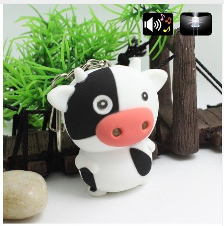 Figura colgante de llave de becerro de vaca con LED y sonido (Muh)