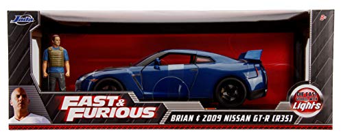 Jada Toys Fast & Furious Brian 's Nissan Skyline GT-R R35 - Luz de Coche Tuning Escala 1:18 con alerón, Puertas abatibles, capó y Maletero, Incluye Figura Brian O'Conner, Color Azul