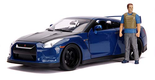 Jada Toys Fast & Furious Brian 's Nissan Skyline GT-R R35 - Luz de Coche Tuning Escala 1:18 con alerón, Puertas abatibles, capó y Maletero, Incluye Figura Brian O'Conner, Color Azul
